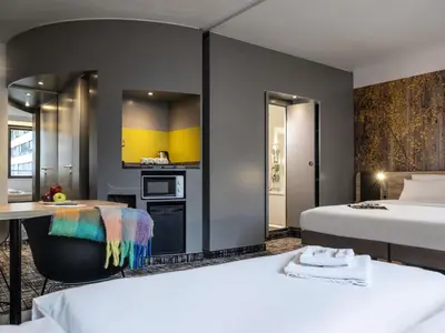 Ein Bett oder Betten in einem Zimmer der Unterkunft Novotel Suites Wien City Donau