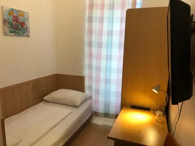 Ein Bett oder Betten in einem Zimmer der Unterkunft Pension Vera