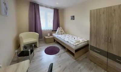 Ein Bett oder Betten in einem Zimmer der Unterkunft Pension Hammrich
