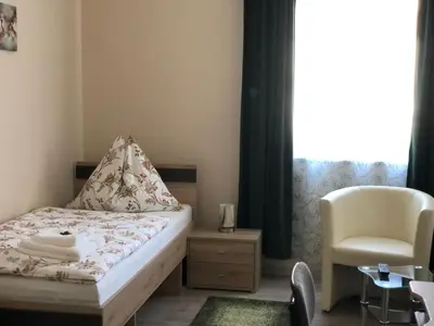 Ein Bett oder Betten in einem Zimmer der Unterkunft Pension Hammrich