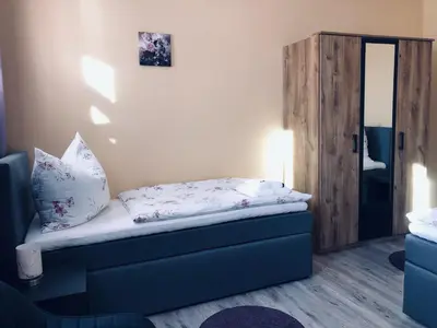 Ein Bett oder Betten in einem Zimmer der Unterkunft Pension Hammrich