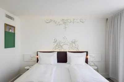 Ein Bett oder Betten in einem Zimmer der Unterkunft ARCOTEL Kaiserwasser Wien