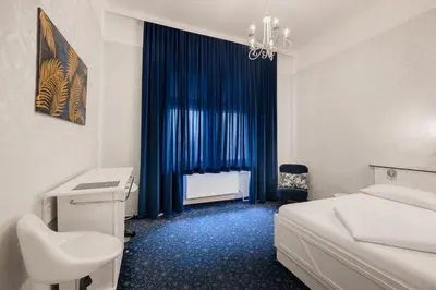 Ein Bett oder Betten in einem Zimmer der Unterkunft Hotel Goldene Spinne