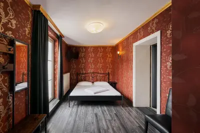 Ein Bett oder Betten in einem Zimmer der Unterkunft Hotel Goldene Spinne