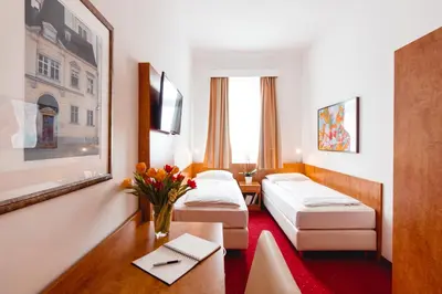 Ein Bett oder Betten in einem Zimmer der Unterkunft Hotel Allegro Wien