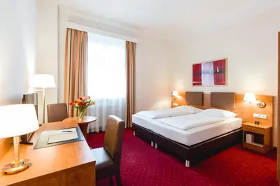 Ein Bett oder Betten in einem Zimmer der Unterkunft Hotel Allegro Wien
