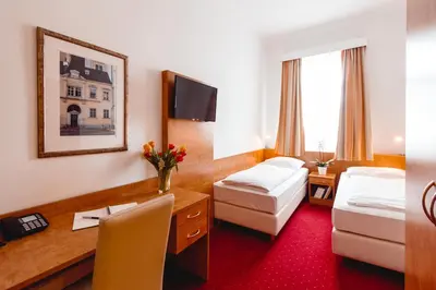 Ein Bett oder Betten in einem Zimmer der Unterkunft Hotel Allegro Wien