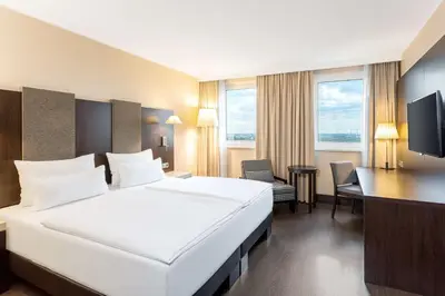 Ein Bett oder Betten in einem Zimmer der Unterkunft NH Danube City
