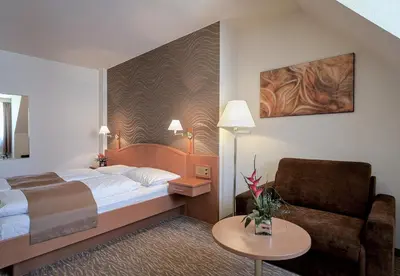 Ein Bett oder Betten in einem Zimmer der Unterkunft Club Hotel Cortina