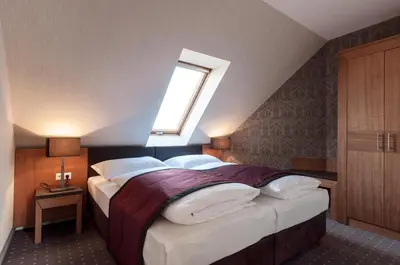 Ein Bett oder Betten in einem Zimmer der Unterkunft Club Hotel Cortina