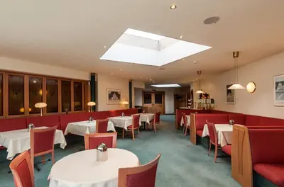 Ein Sitzbereich in der Unterkunft Club Hotel Cortina