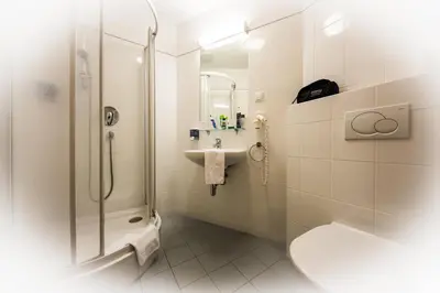 Ein Badezimmer in der Unterkunft Club Hotel Cortina
