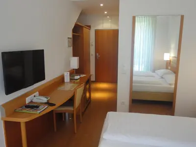 Ein Bett oder Betten in einem Zimmer der Unterkunft City Hotel Albrecht
