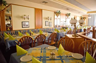 Ein Restaurant oder anderes Speiselokal in der Unterkunft Hotel Restaurant Müllner