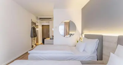Ein Bett oder Betten in einem Zimmer der Unterkunft PLAZA INN Wien Gasometer