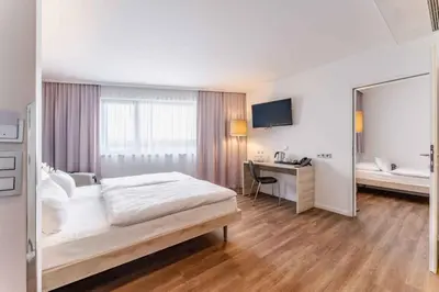 Ein Bett oder Betten in einem Zimmer der Unterkunft PLAZA INN Wien Gasometer