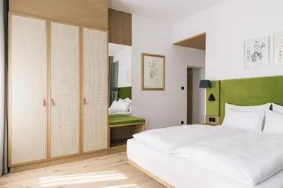 Ein Bett oder Betten in einem Zimmer der Unterkunft Bio-Hotel Schani Wienblick
