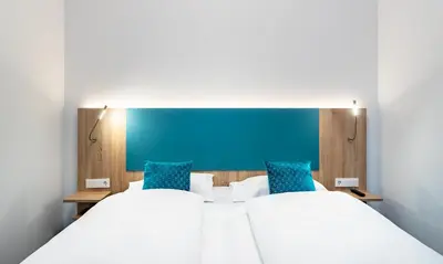 Ein Bett oder Betten in einem Zimmer der Unterkunft DaunTown Rooms - Self Check-In