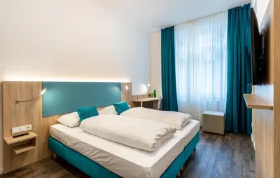 Ein Bett oder Betten in einem Zimmer der Unterkunft DaunTown Rooms - Self Check-In