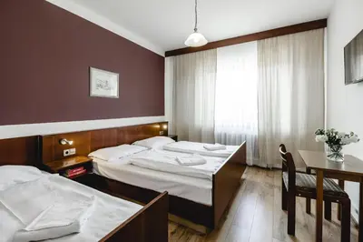 Ein Bett oder Betten in einem Zimmer der Unterkunft Hotel Hoffinger