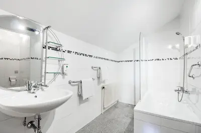 Ein Badezimmer in der Unterkunft Hotel Hoffinger