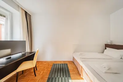 Ein Bett oder Betten in einem Zimmer der Unterkunft Serviced Apartments Josefstadt City