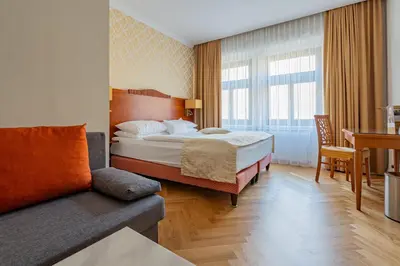 Ein Bett oder Betten in einem Zimmer der Unterkunft Hotel Josefshof am Rathaus