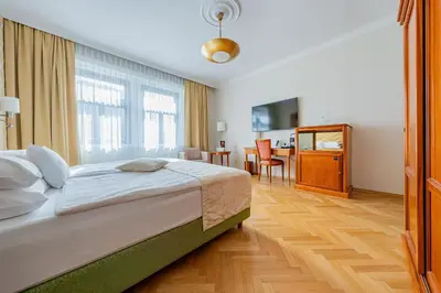 Ein Bett oder Betten in einem Zimmer der Unterkunft Hotel Josefshof am Rathaus