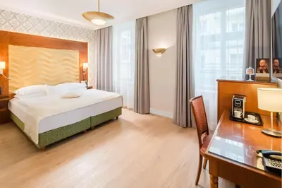 Ein Bett oder Betten in einem Zimmer der Unterkunft Hotel Josefshof am Rathaus