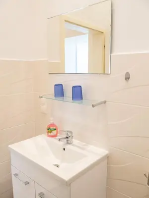 Ein Badezimmer in der Unterkunft Appartements CHE