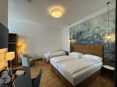 Ein Bett oder Betten in einem Zimmer der Unterkunft Hotel Secession an der Oper