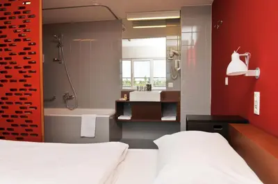 Ein Bett oder Betten in einem Zimmer der Unterkunft Kyriad Vienna Altmannsdorf