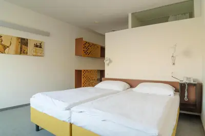 Ein Bett oder Betten in einem Zimmer der Unterkunft Kyriad Vienna Altmannsdorf