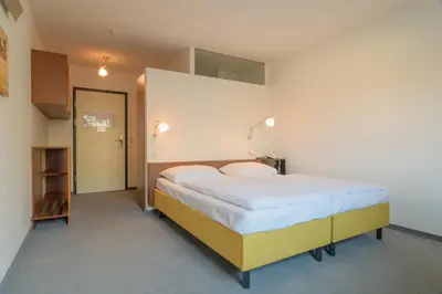 Ein Bett oder Betten in einem Zimmer der Unterkunft Kyriad Vienna Altmannsdorf