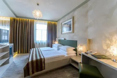 Ein Bett oder Betten in einem Zimmer der Unterkunft Hotel Vienna beim Prater