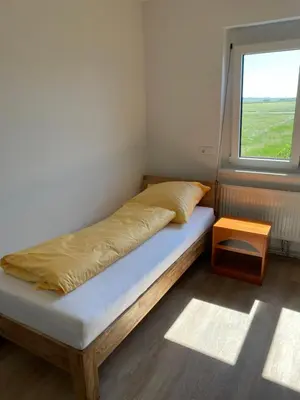 Ein Bett oder Betten in einem Zimmer der Unterkunft SITE.INN Wien