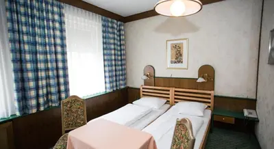 Ein Bett oder Betten in einem Zimmer der Unterkunft Hotel Hadrigan
