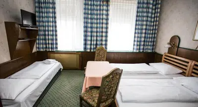 Ein Bett oder Betten in einem Zimmer der Unterkunft Hotel Hadrigan
