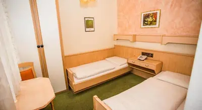Ein Bett oder Betten in einem Zimmer der Unterkunft Hotel Hadrigan