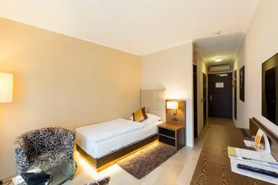 Ein Bett oder Betten in einem Zimmer der Unterkunft Hotel Sacher Baden