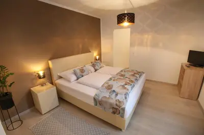 Ein Bett oder Betten in einem Zimmer der Unterkunft Zentrum 2 Mörbisch