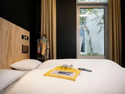 Ein Bett oder Betten in einem Zimmer der Unterkunft JO&JOE Vienna