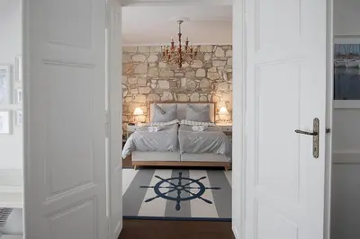 Ein Bett oder Betten in einem Zimmer der Unterkunft Captain's Suite