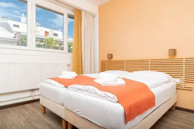 Ein Bett oder Betten in einem Zimmer der Unterkunft Apartments Favoriten