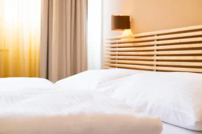 Ein Bett oder Betten in einem Zimmer der Unterkunft Apartments Favoriten