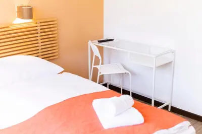 Ein Bett oder Betten in einem Zimmer der Unterkunft Apartments Favoriten