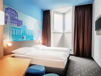 Ein Bett oder Betten in einem Zimmer der Unterkunft B&B Hotel Wien-Meidling