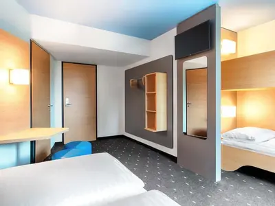 Ein Bett oder Betten in einem Zimmer der Unterkunft B&B Hotel Wien-Meidling