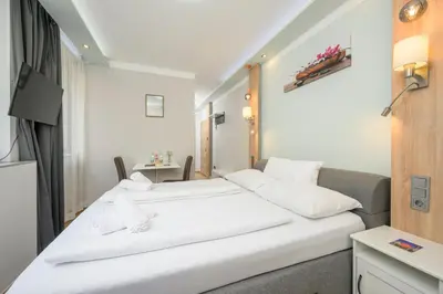 Ein Bett oder Betten in einem Zimmer der Unterkunft Palais Pálffy Apartments Vienna