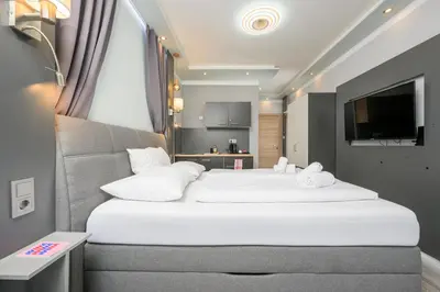 Ein Bett oder Betten in einem Zimmer der Unterkunft Palais Pálffy Apartments Vienna